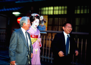 A Maiko with two business man Kyoto Japan