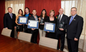 Business people receiving awards